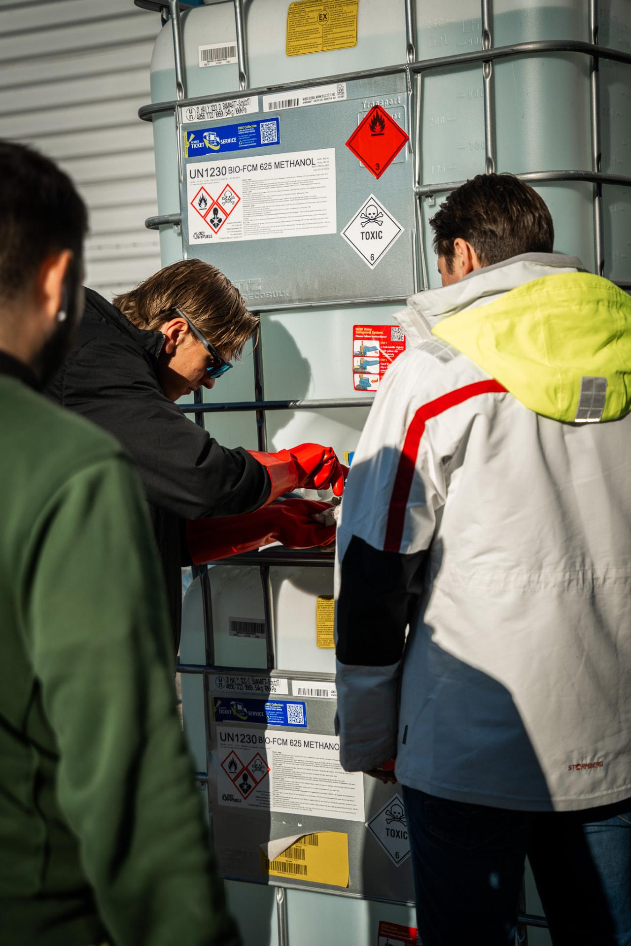 Operators inspecting certified biomethanol containers at the facility at Kløfta